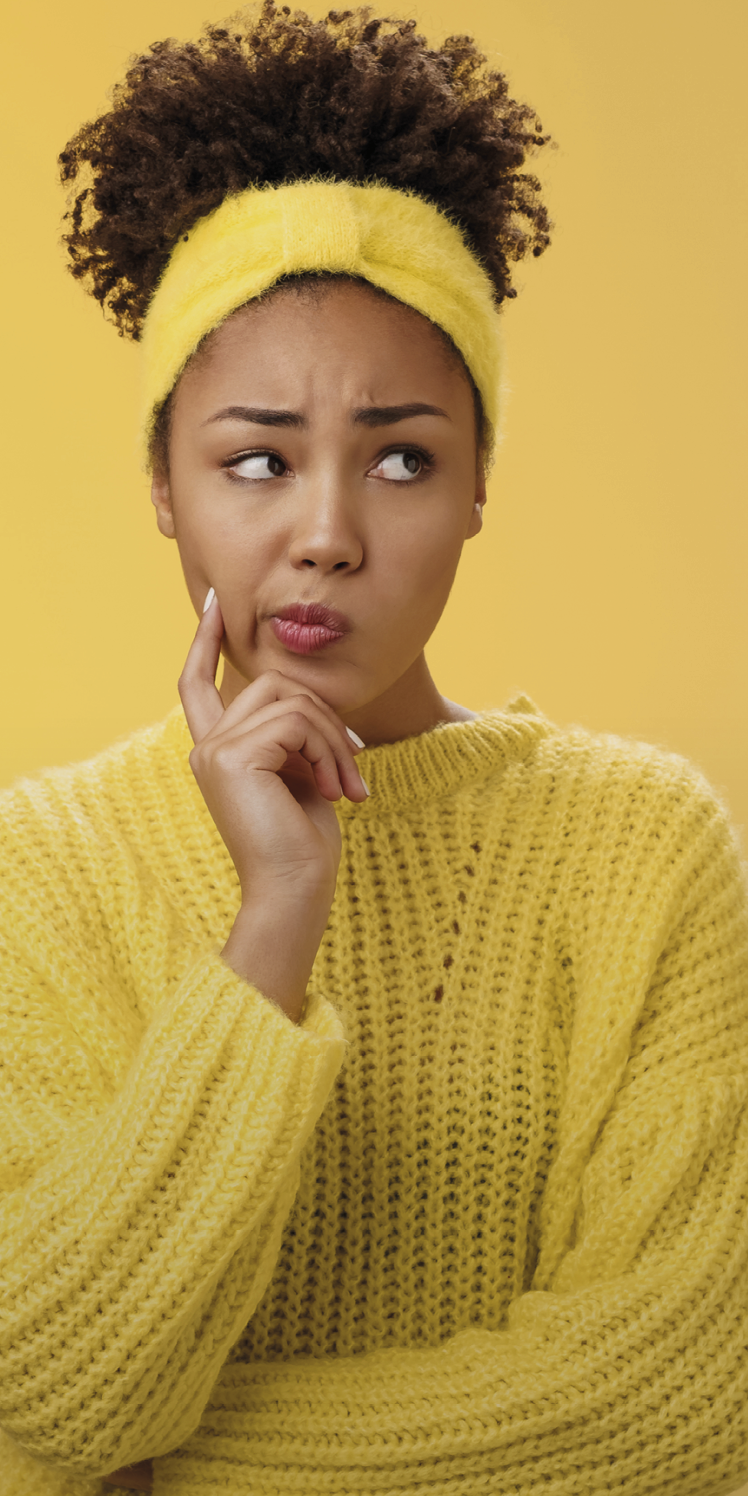 Perplexed unsure cute timid african-american female thinking how escape awkward situation smirking frowning concerned touch cheek thoughtful thinking nervously, worried yellow background.